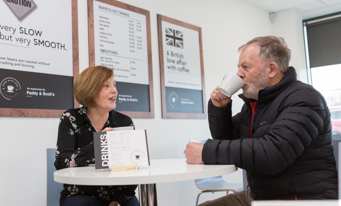 two people sat in cafe at long stratton leisure centre drinking a hot drink